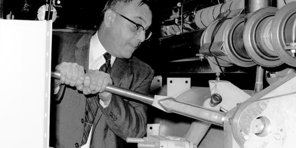 Larry Mohr (AEC) tightening last bolt on linac, 2/10/1966