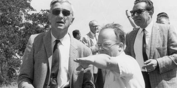 W K H Panofsky (pointing) and Felix  Bloch at SLAC site picnic, 1962.