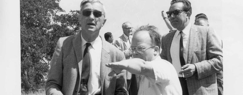 W K H Panofsky (pointing) and Felix  Bloch at SLAC site picnic, 1962.