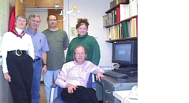 SLAC's web wizards posing in office in front of desktop computer