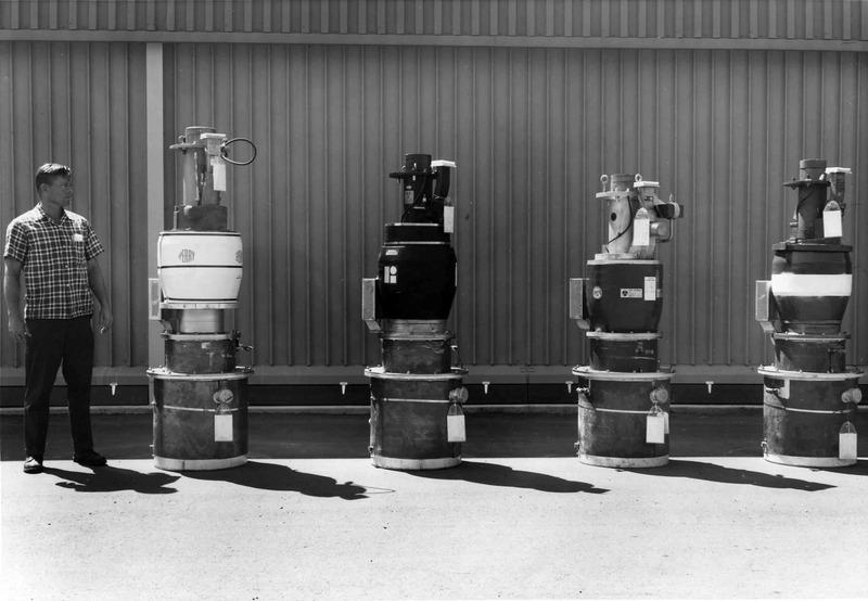 Four klystrons with man (showing scale), 1966