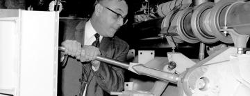 Larry Mohr (AEC) tightening last bolt on linac, 2/10/1966
